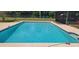 A refreshing swimming pool with clear water awaits on a sunny day at 5211 Berkley Rd, Auburndale, FL 33823