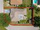 Aerial view of a home with a manicured lawn, shed, patio, and outlined property at 5733 Oakwood Knoll Dr, Lakeland, FL 33811