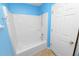 Bright bathroom showcasing a white tub and shower with a neutral colored flooring at 5733 Oakwood Knoll Dr, Lakeland, FL 33811
