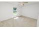 Neutral bedroom with standard closet and a bright window view at 5733 Oakwood Knoll Dr, Lakeland, FL 33811