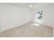 Neutral bedroom with standard closet and a bright window view at 5733 Oakwood Knoll Dr, Lakeland, FL 33811