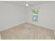 Neutral bedroom with standard closet and a bright window view at 5733 Oakwood Knoll Dr, Lakeland, FL 33811