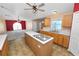 Bright kitchen with island, double sink, and open layout to the living and dining areas at 5733 Oakwood Knoll Dr, Lakeland, FL 33811
