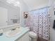 Well-lit bathroom with a shower/tub combination and updated fixtures at 6087 Southern Oaks Se Dr, Winter Haven, FL 33884