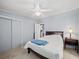 Cozy bedroom with carpet flooring and plenty of natural light from the window at 6087 Southern Oaks Se Dr, Winter Haven, FL 33884
