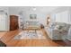 Spacious living room featuring hardwood floors, ceiling fan, and neutral paint at 6087 Southern Oaks Se Dr, Winter Haven, FL 33884