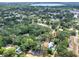 This aerial view highlights the home's location within a neighborhood setting, with a nearby lake at 618 W Oak Dr, Lakeland, FL 33803