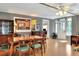 Cozy dining room with wood table and seating for six, adjacent to the kitchen at 618 W Oak Dr, Lakeland, FL 33803