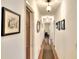 Hallway with hardwood floors and artwork at 618 W Oak Dr, Lakeland, FL 33803