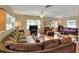 Open-concept living room with hardwood floors and large windows for natural light at 618 W Oak Dr, Lakeland, FL 33803