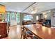 Open-concept living and dining area with hardwood floors and large windows for natural light at 618 W Oak Dr, Lakeland, FL 33803