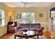 Inviting living room with neutral walls, hardwood floors, and traditional furniture at 618 W Oak Dr, Lakeland, FL 33803