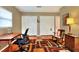 Spacious office boasts hardwood flooring, rocking chair and closet at 618 W Oak Dr, Lakeland, FL 33803
