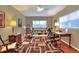 Office showcasing hardwood floors, lots of light, ceiling fan and built-in bookshelf at 618 W Oak Dr, Lakeland, FL 33803