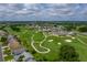 Beautiful aerial view of a golf course community with lush green fairways and manicured landscaping at 6194 Sanderling Dr, Lakeland, FL 33809