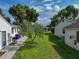 Spacious backyard with lush green grass and mature trees at 6194 Sanderling Dr, Lakeland, FL 33809
