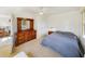 Bright bedroom with a dresser, nightstand, and a comfortable bed at 6194 Sanderling Dr, Lakeland, FL 33809