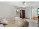 Bedroom featuring window, neutral carpet, light walls, closet, and bed at 6194 Sanderling Dr, Lakeland, FL 33809