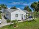 Home exterior features a well-manicured lawn and an attached garage at 6194 Sanderling Dr, Lakeland, FL 33809