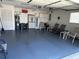 Clean garage with epoxy flooring and storage, showing organization and space at 6194 Sanderling Dr, Lakeland, FL 33809