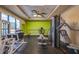 Well-equipped gym with modern exercise machines and a large window for natural light at 6194 Sanderling Dr, Lakeland, FL 33809