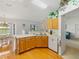 Spacious kitchen with wood floors, wood cabinets, and stainless steel appliances at 6194 Sanderling Dr, Lakeland, FL 33809