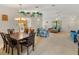 Bright, open living room with dining area, ceiling fan and comfortable blue furnishings at 6194 Sanderling Dr, Lakeland, FL 33809