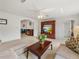 Spacious living area featuring a sectional sofa and entertainment center at 6194 Sanderling Dr, Lakeland, FL 33809
