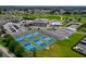 Community pickleball courts, pool and clubhouse with ample parking and lush green landscaping at 6194 Sanderling Dr, Lakeland, FL 33809