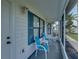 Inviting screened-in porch with comfortable seating, perfect for enjoying the fresh air and neighborhood views at 6194 Sanderling Dr, Lakeland, FL 33809