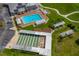 Aerial view of community shuffleboard, surrounded by trees and lush landscaping at 6194 Sanderling Dr, Lakeland, FL 33809