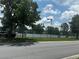 Community outdoor tennis courts with lighting and fencing at 6194 Sanderling Dr, Lakeland, FL 33809