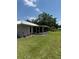Backyard showing the screened porch, yard, and house exterior at 629 N Cleveland Ave, Fort Meade, FL 33841