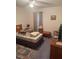 A comfy bedroom features a ceiling fan, window, and traditional furnishings at 629 N Cleveland Ave, Fort Meade, FL 33841