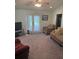 Spacious living area with a cozy sofa and chair, perfect for relaxation at 629 N Cleveland Ave, Fort Meade, FL 33841