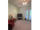 Inviting living room with carpet, ceiling fan and access to the outdoors at 629 N Cleveland Ave, Fort Meade, FL 33841