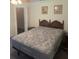 Main bedroom featuring carpet, walk-in closet, and neutral tones at 629 N Cleveland Ave, Fort Meade, FL 33841