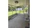 Spacious screened-in porch with a tiled floor and view of the backyard at 629 N Cleveland Ave, Fort Meade, FL 33841
