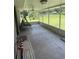 Enclosed screened-in porch with tile flooring and backyard views at 629 N Cleveland Ave, Fort Meade, FL 33841