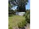 Backyard features 2 storage sheds and a grassy lawn at 629 N Cleveland Ave, Fort Meade, FL 33841