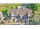Aerial view of townhouses featuring well-maintained landscaping, driveways, and parking spaces at 6435 Sedgeford Dr, Lakeland, FL 33811