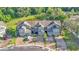 Aerial view of townhouses featuring well-maintained landscaping, driveways, and garages at 6435 Sedgeford Dr, Lakeland, FL 33811