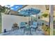 Charming backyard featuring a patio with outdoor seating and lush landscaping, perfect for relaxing at 6435 Sedgeford Dr, Lakeland, FL 33811