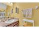 Bright bathroom featuring a vanity with a sink, mirror, and neutral paint scheme at 6435 Sedgeford Dr, Lakeland, FL 33811