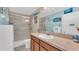 Bathroom featuring a shower with sliding glass doors, vanity, and nautical decor at 6435 Sedgeford Dr, Lakeland, FL 33811
