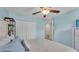 Bright bedroom featuring light blue walls and a view to the doorway at 6435 Sedgeford Dr, Lakeland, FL 33811