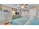 Comfortable bedroom featuring a ceiling fan, and coastal-themed decor at 6435 Sedgeford Dr, Lakeland, FL 33811