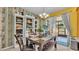 Dining room table set with seating, bright light, and view to enclosed patio at 6435 Sedgeford Dr, Lakeland, FL 33811