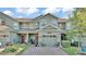 Charming two-story townhome features a one car garage and lovely landscaping at 6435 Sedgeford Dr, Lakeland, FL 33811