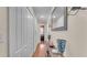 Hallway featuring hard wood floors and a wall mirror at 6435 Sedgeford Dr, Lakeland, FL 33811